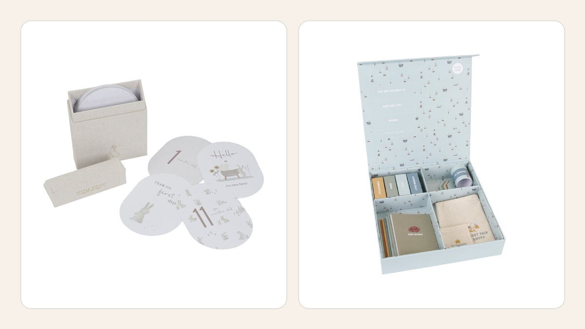Baby-Bunny-Meilensteinkarten und geöffnete blaue Sailors-Bay-Erinnerungsbox als private Baby-Erinnerungen